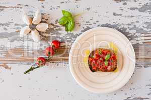 Italian bruschetta with tomato and basil seen from above