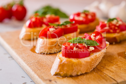 Closeup of Italian bruschetta with tomato, basil and garlic