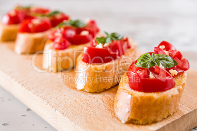 Closeup of Italian bruschetta with tomato, basil and garlic