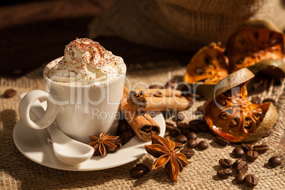 Close-up of coffee with whipped cream and cocoa powder