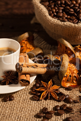 Close-up of coffee cup with cinnamon and star anise