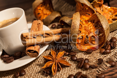 Close-up of cup of coffee with cinnamon and star anise