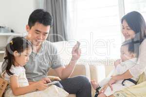 Asian family doing online shopping