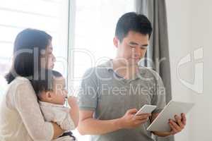 Asian family scanning QR code