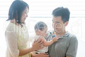 Asian parents and baby son