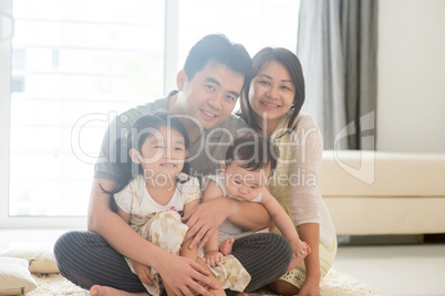 Portait of Asian family at home