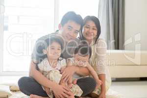 Portait of Asian family at home