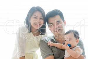 Asian parents and baby boy