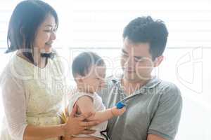 Asian parents and baby