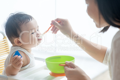 Mother feeding baby.