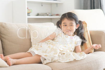 Little girl watching tv.