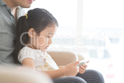 Father and daughter using tablet pc.