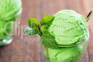 Cup of pistachio ice cream close up