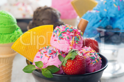 Pink ice cream with fruits in bowl