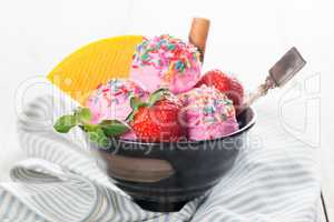 Strawberry ice cream with fruits in bowl