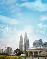 Daytime view of famous Asy-Syakirin Mosque with Petronas Towers