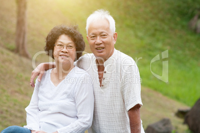 Elderly Asian couple outdoor.