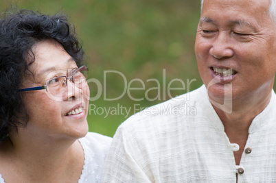 Elderly Asian couple outdoor portrait.