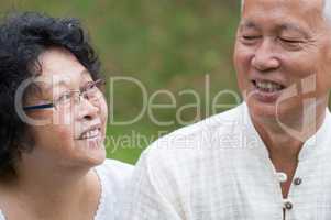 Elderly Asian couple outdoor portrait.