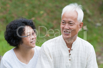 Mature Asian couple outdoor portrait.