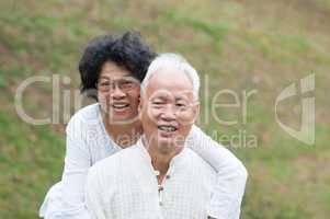 Senior Asian couple outdoor portrait.