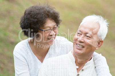 Senior Asian couple relaxing outdoor.