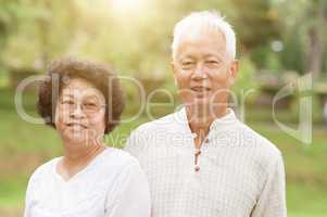 Happy elderly Asian couple.