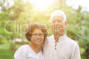 Happy old Asian couple smiling.