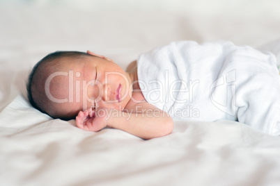 Asian newborn baby boy sleeping