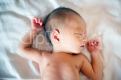 Asian newborn sleeping