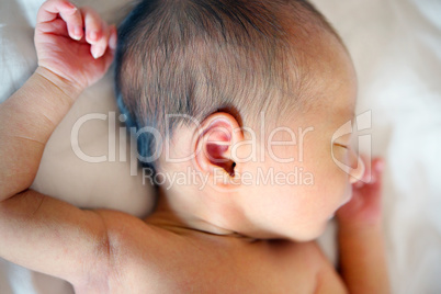 Sleeping Asian newborn baby