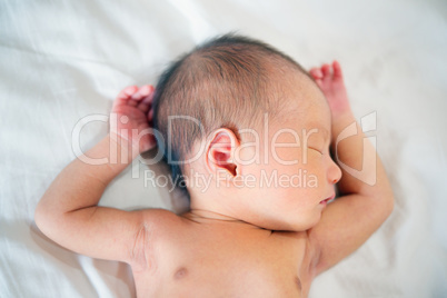 Sleeping newborn baby boy.