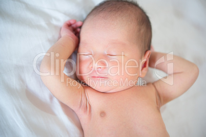 One week old newborn baby boy sleeping