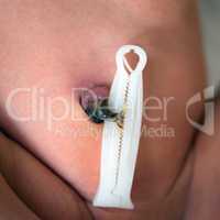 Close up umbilical cord with clamp of newborn