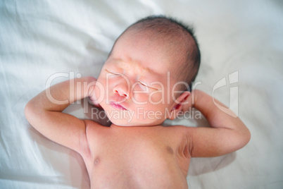 One week old newborn baby dreaming