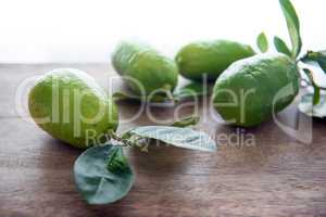 Fresg organic green lemons with leaves