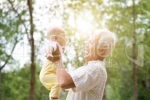 Grandparent playing with grandchild.