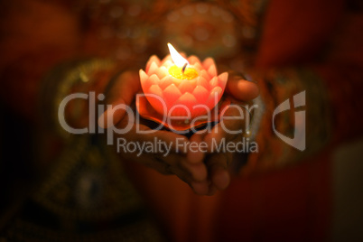Diwali oil lamp with hands