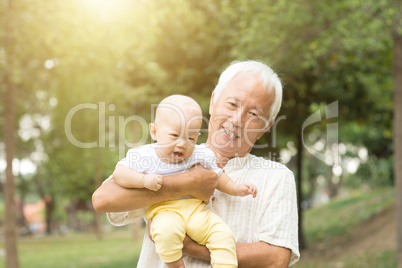 Grandfather and grandson at the park.
