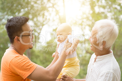 Asian grandfather, father and grandchild.