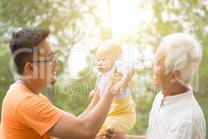 Asian grandfather, father and grandchild.