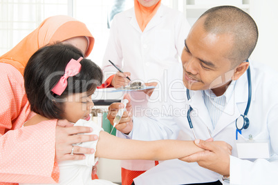Doctor giving children vaccine