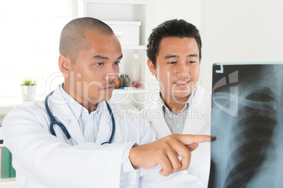 Medical doctors checking on x-ray scan