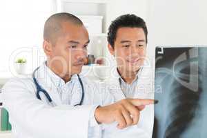 Medical doctors checking on x-ray scan