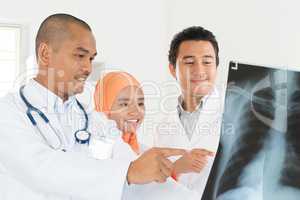 Doctors discussing on x-ray scan