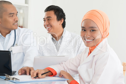 Asian doctors meeting at hospital office.