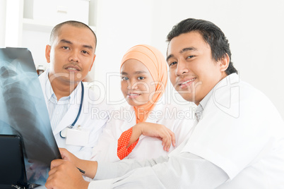 Asian Doctors discussing on x-ray image