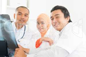 Asian Doctors discussing on x-ray image