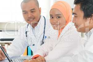 Medical doctors discussing at hospital office.