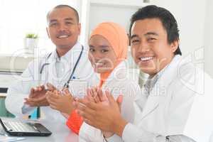 Medical doctors clapping hands